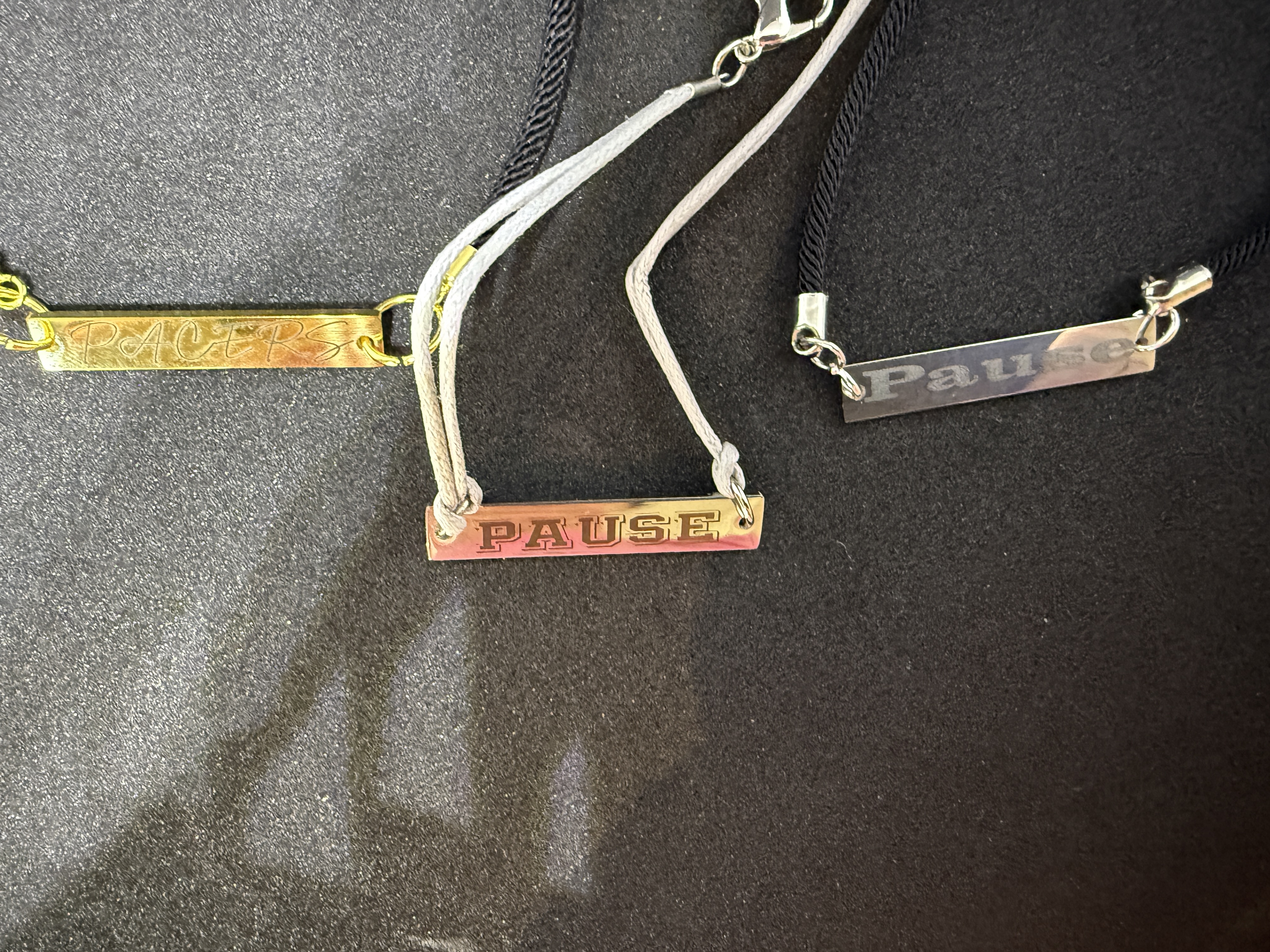 The alt text for this image reads: "Silver engraved cuff bracelet with two engraving tools."