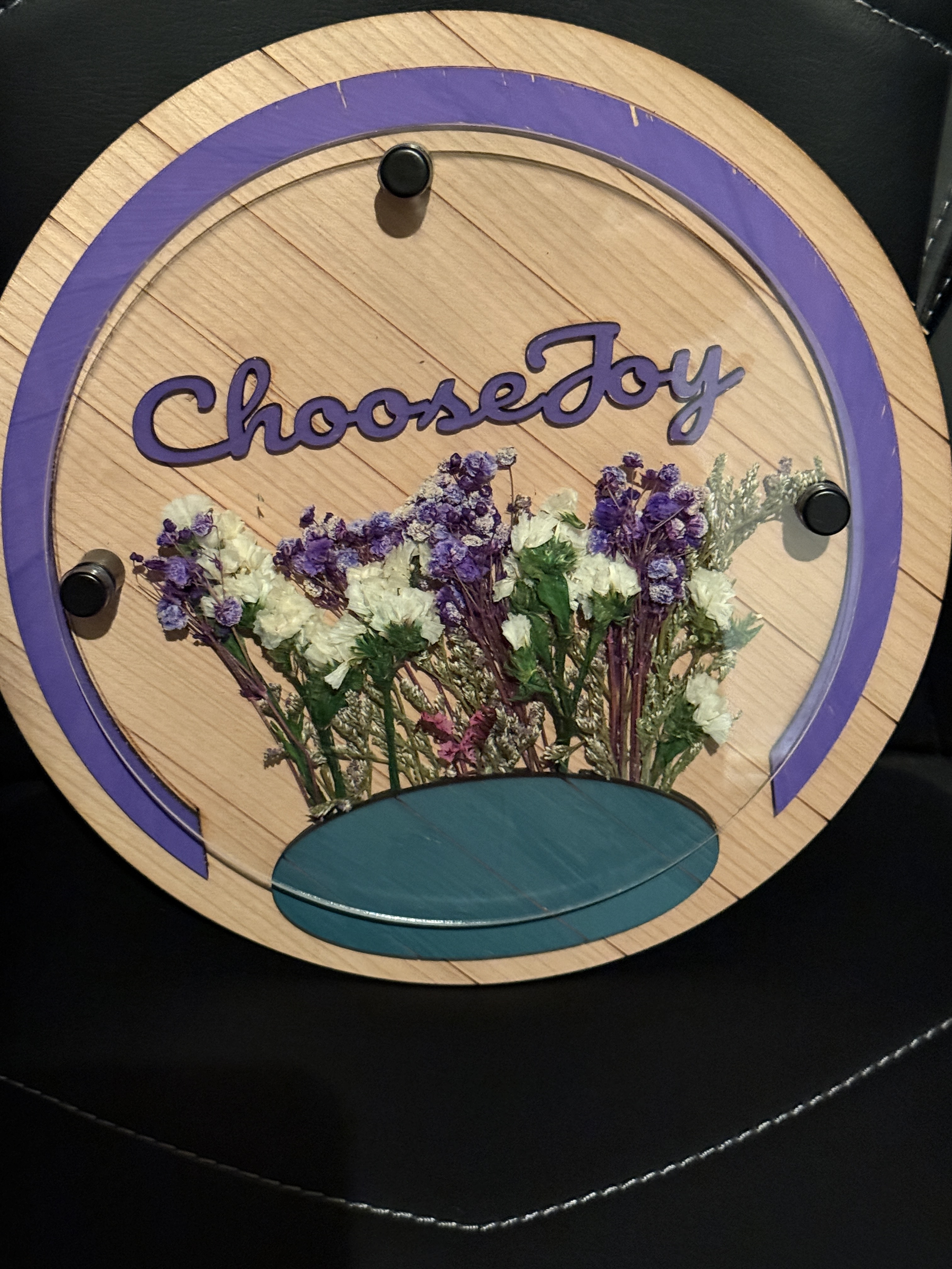 The image features a pair of rose gold cufflinks displayed in a wooden box or storage container specifically designed to s...