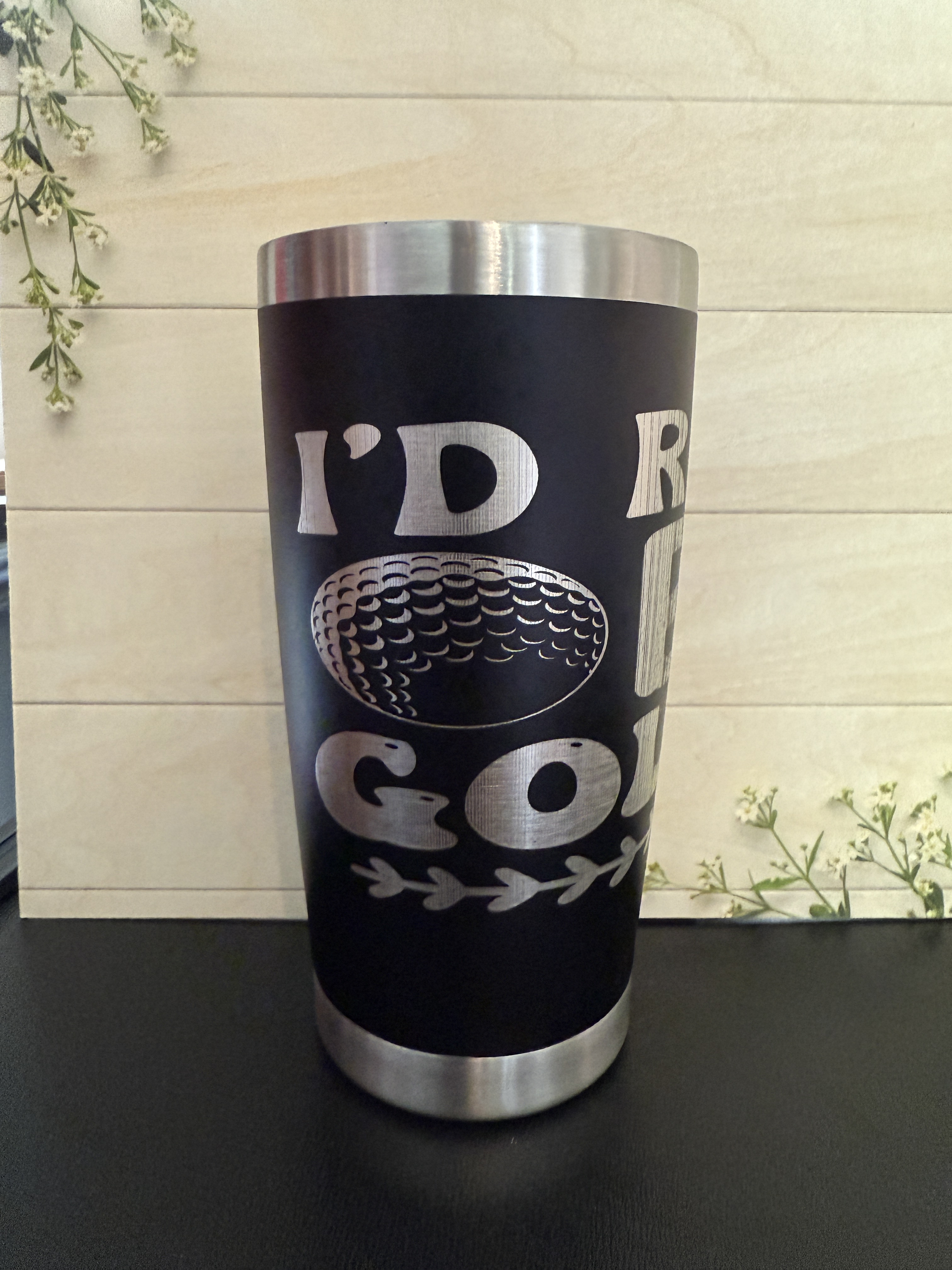 The silver and dark-walnut wood pendent photo-manipulation image contains light tones. The subject differs from the backro...